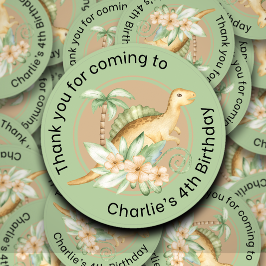 Personalised dinosaur sticker on a green background with flowers and foliage