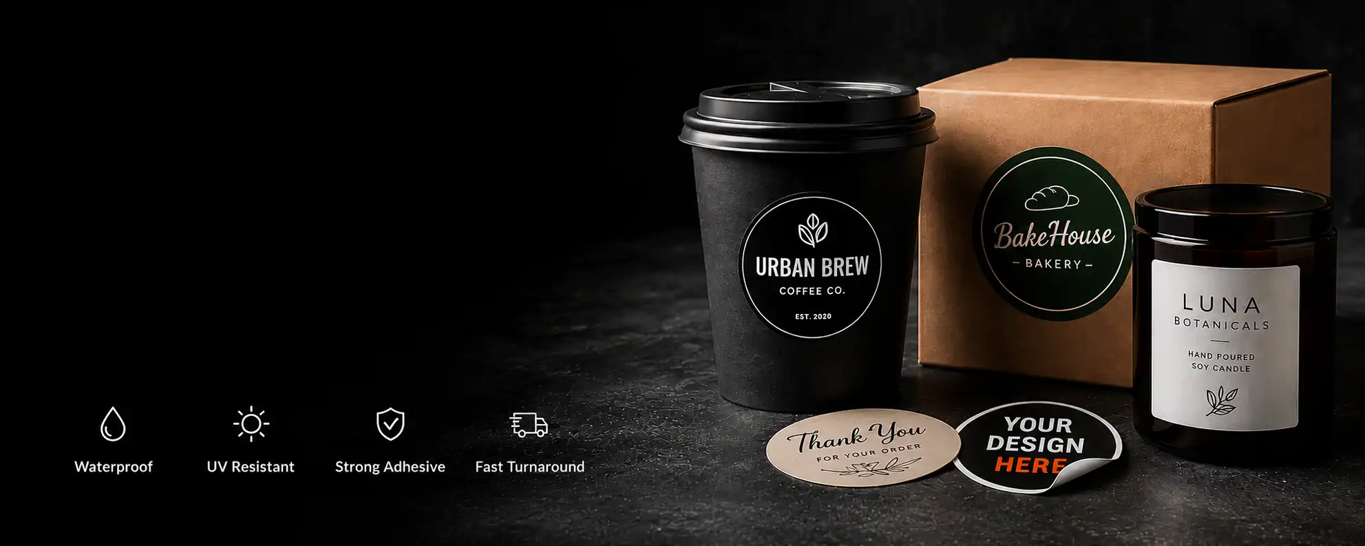 decorative hero image featuring a coffee cup, packaging box and candle with stickers and labels attached
